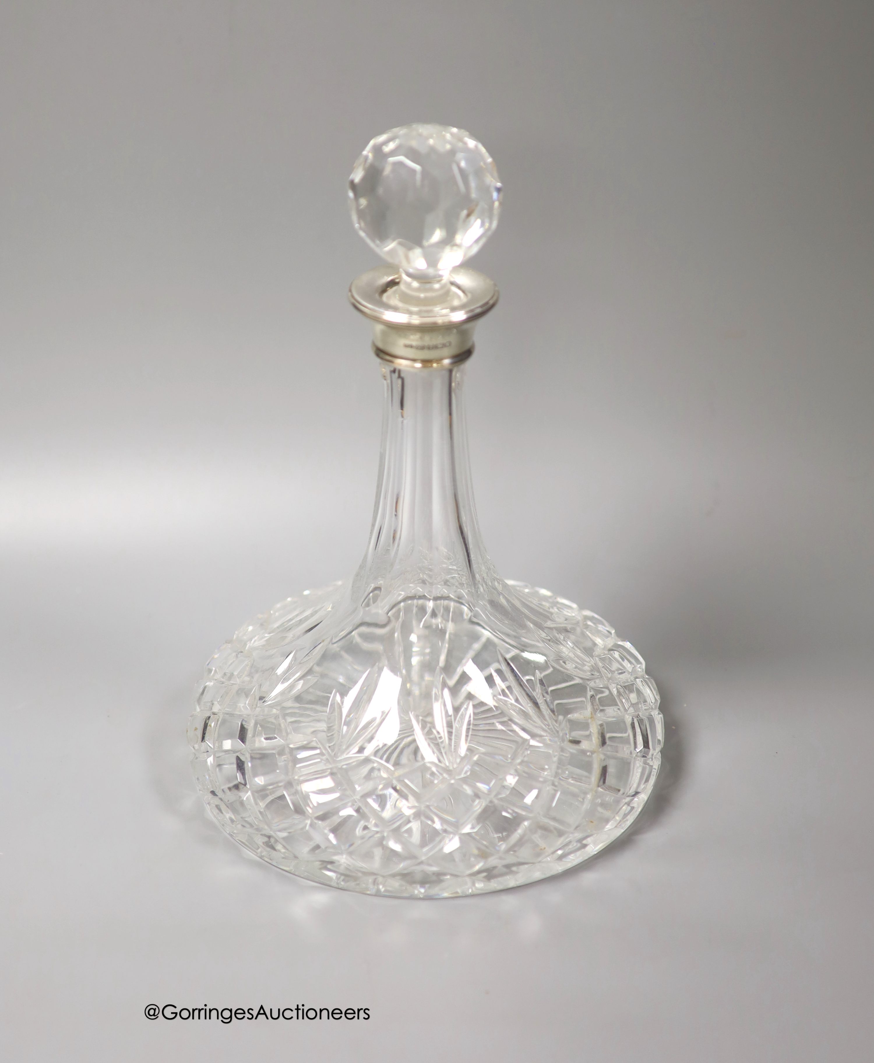 A modern silver collared cut glass ship's decanter, height 28cm.